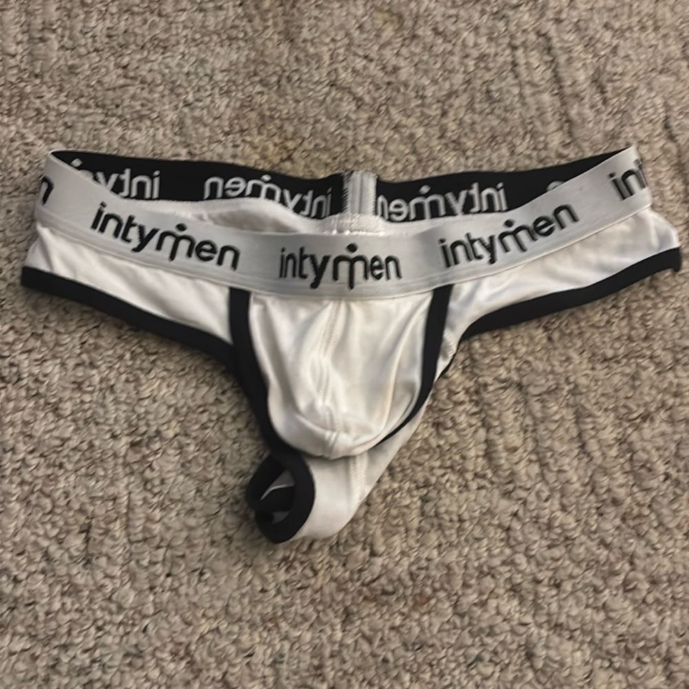 Intymen thong with lift up pouch and built in ring